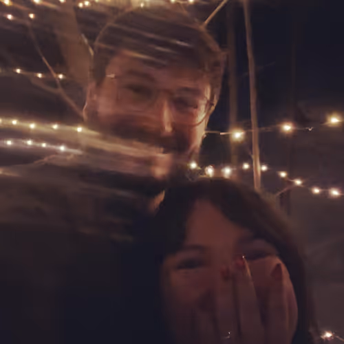 Tristan and Lindsay posing for a picture. Lindsay shows off her new engagement ring.